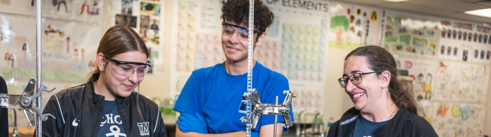 Students and teacher performing experiments